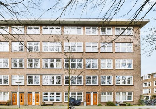 Facade of low rise brick building in residential district of city in Netherlands